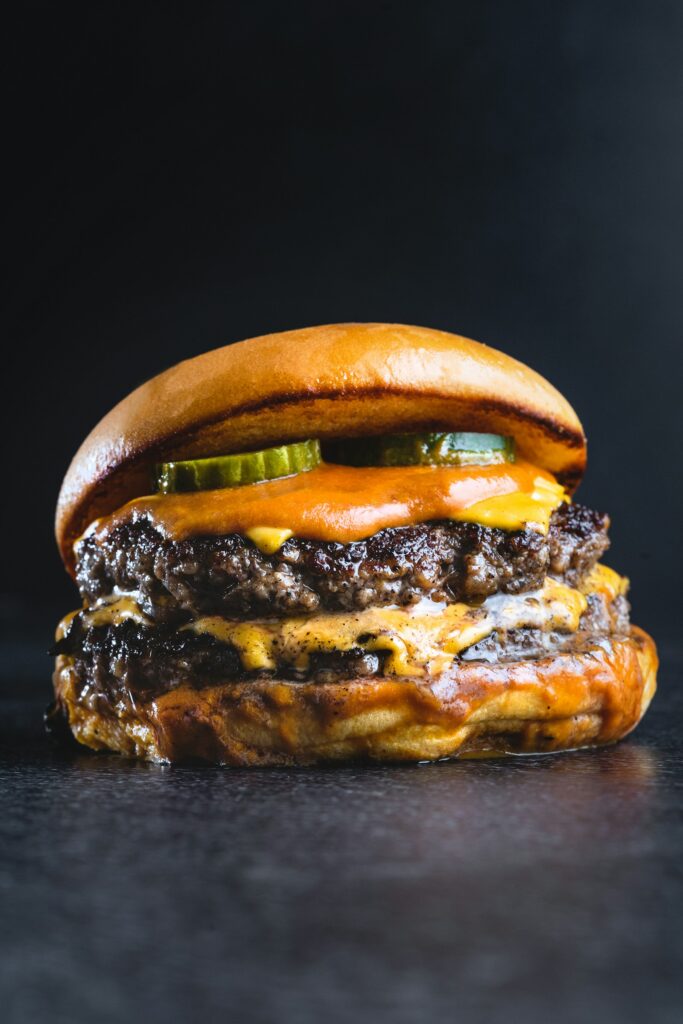Freshly prepared burger — illustrative trader photograph